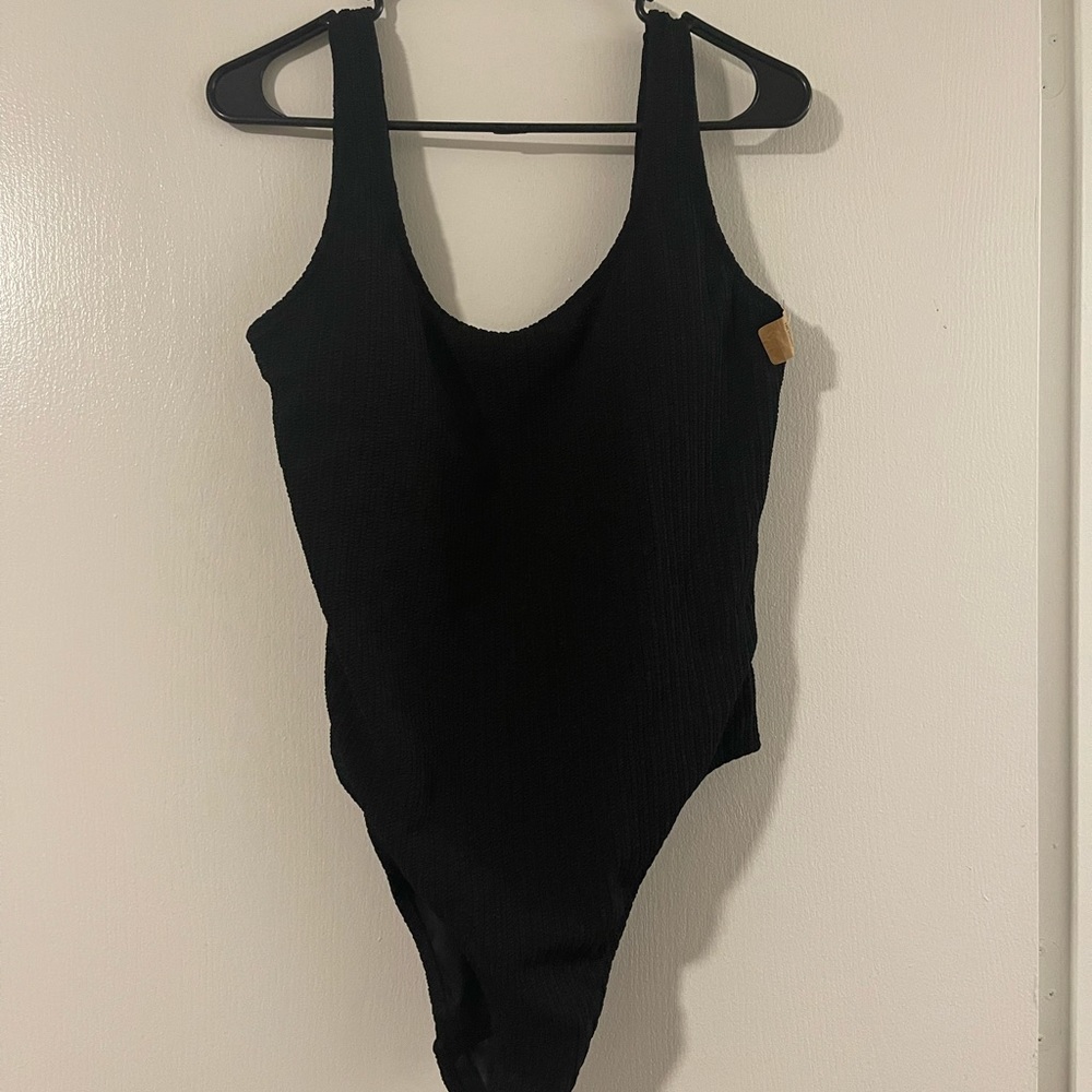 Pink Victoria’s Secret. One piece crinkle swim suit.